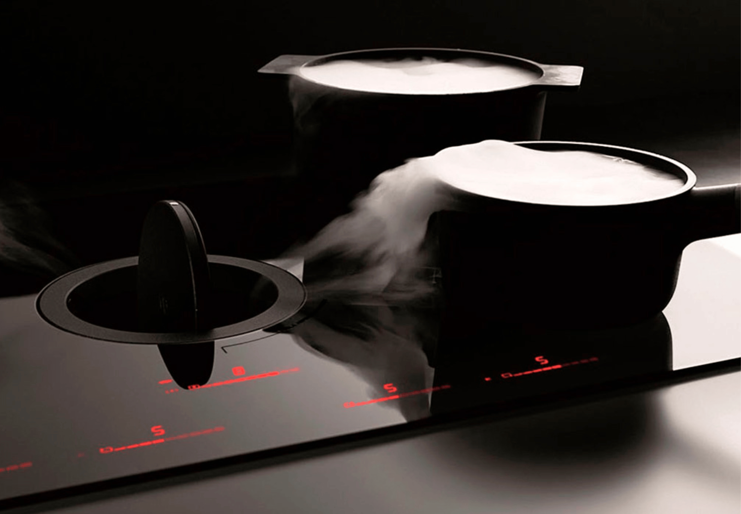 Hobs with integrated cooker hoods